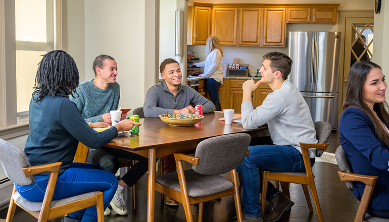 a group of patients at a dining table